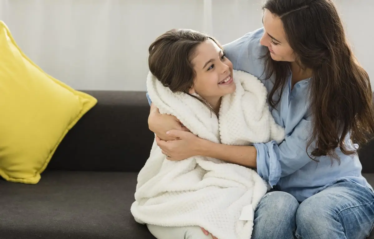 A parent comforting a child, the safety and security the court puts first