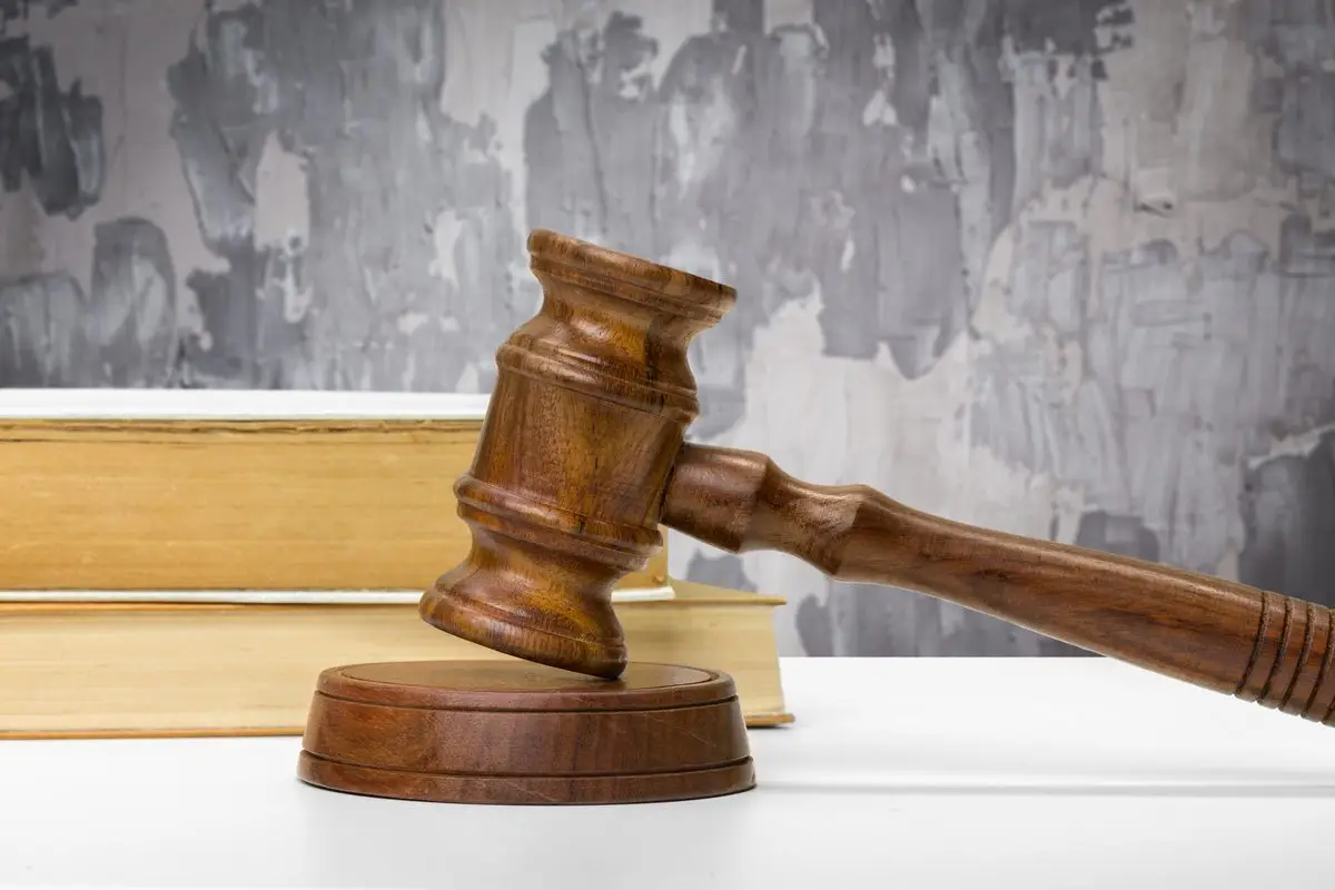 A judge's gavel resting on law books